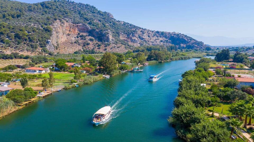 Dalyan is a town in Muğla Province of Turkey. River hosts the caretta caretta and many birds and fishs. Dalyan River takes boats to the Iztuzu Beach.