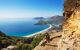 Backpacker admiring the view of the bay and landscapes from the hiking trail