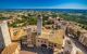 Dizzy top view of the medieval village of San Gimignano near Siena under the sun of Tuscany