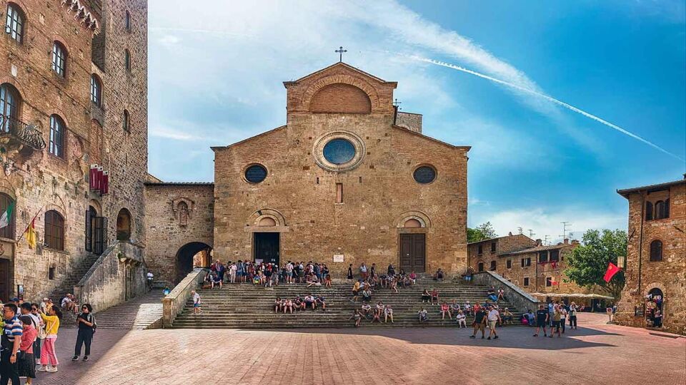 View of the Collegiate Church of Santa Maria Assunta, iconic basilica and major landmark in the historic centre of San Gimignano