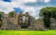 An Abbey window ruin of tumbled stone walls