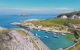 A harbour rich with vegetation and people enjoying the sun