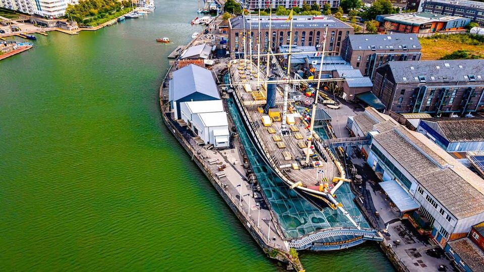 Aerial view of the old ship docked in shipyard