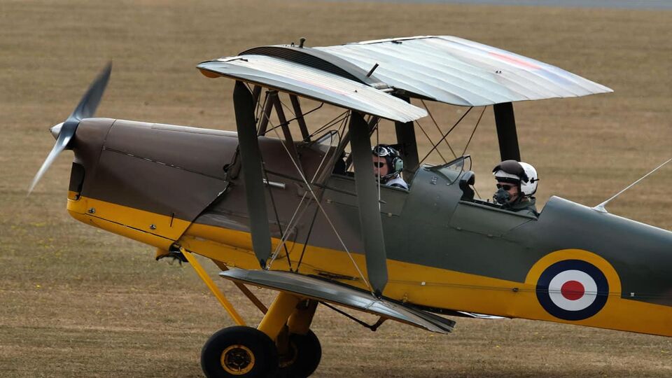 Picture of a Tiger Moth airplane on runway