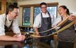 Three poeple making pasta in Raymond Blanc's cooking school