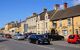 High street in a village, including a traditional inn.