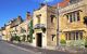 The exterior of the Manor House Hotel on a sunny day.