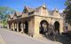 Exterior of the old market hall on a sunny day.