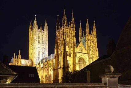 Facade of Canterbury Cathedral illuminated at night