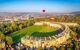 Aerial view of the crescent with two red hot air balloons above it
