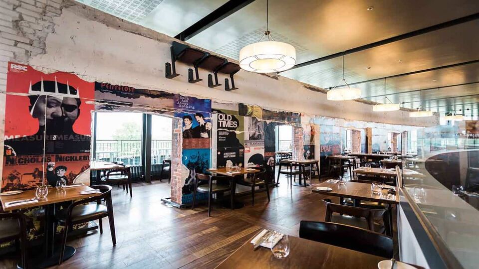 A photo showing the inside view of the rustic and modern interior at the Rooftop restaurant in Royal Shakespeare Company