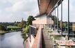 A balcony perspective of the Rooftop restaurant at the Royal Shakespeare Company with picturesque view of the River Anon running beside the theatre.
