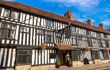 Half-timbered white house in Stratford upon Avon in a beautiful summer day