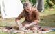 Anglo-saxon clay pottery maker sitting at the national park