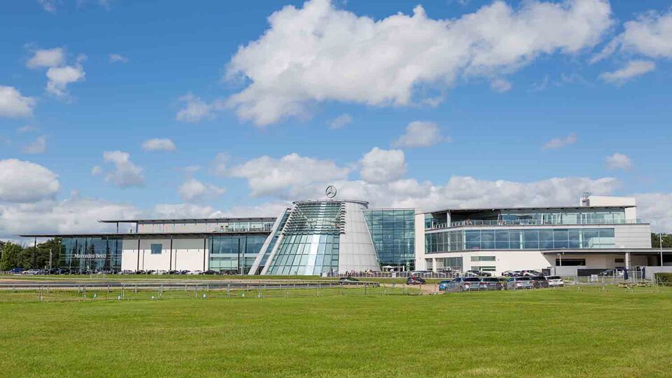 A landscape of Mercedes-Benz World on a sunny blue day