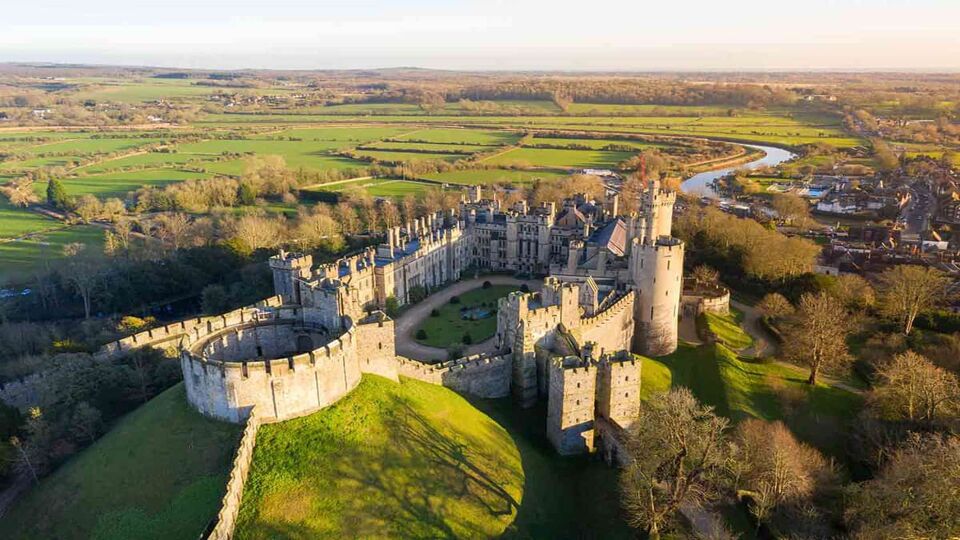 Birds eye view of Arundel Castle during a beautiful sunset light