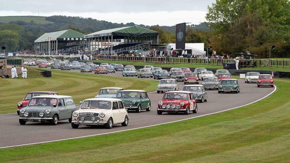A colourful parade of British 'Mini' cars pack the track at the vintage Revival event. The vehicles represent and celebrate 60 years of production.