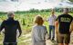 man giving a talk in a vineyard