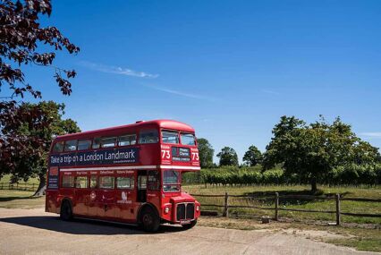 double decker red bus on a vintage winery tour in sussex
