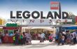 A landscape view of the entrance Legoland with many families and attendees