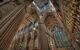 Interior of medieval cathedral showing stained-glass windows