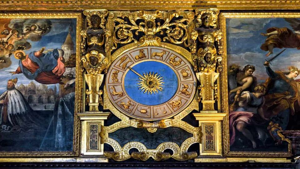 Clock with Zodiac signs in Doge's Palace (Palazzo Ducale) in Venice. Luxury interior of the Senate Chamber of Doge's Palace