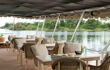 comfy chairs and tables on board the cruise boat