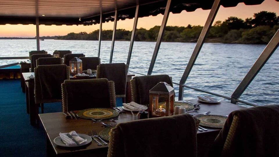 Tables laid for dinner on the cruise on the Zambezi