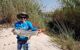 Man holding caught tiger fish