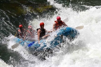 People in a raft in the white-water rapids on the Zambezi