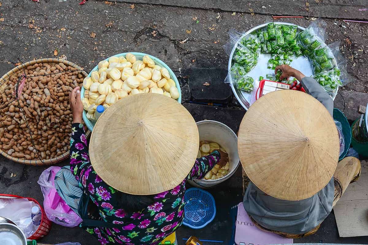 Vendors sell snacks on street in Saigon (Ho Chi Minh city), Vietnam. Saigon is the largest city in Vietnam and the former capital of the Republic of Vietnam.