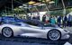 close up of a silver sports car in an exhibition room