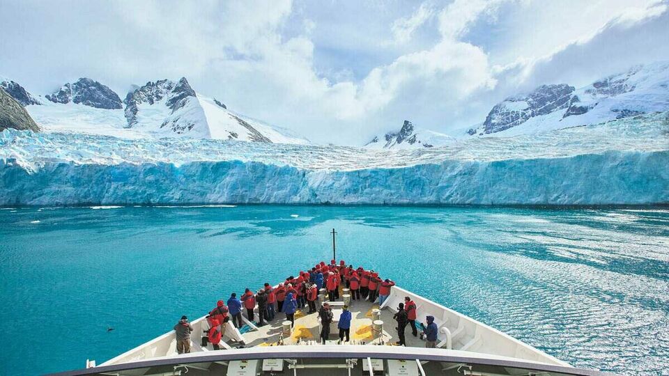 Guests observing South Goergia's Risting Glacier from the deck.