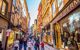 narrow streets filled with tourists shopping