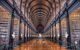 view looking down a hallway with millions of brown books on either side