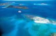 tiny cruise ship boat in a beautiful blue island landscape
