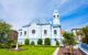 Exterior of a cute light blue church