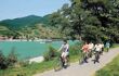 Family group cycling along the banks of the Danube