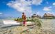 Local tahitian man was canoeing for food delivery in Tikehau island resort in French polynesia.