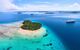 Aerial of Nuku Island, a small atoll surrounded by blue sea