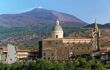 Landscape of a small church with Mount Etna rising behind