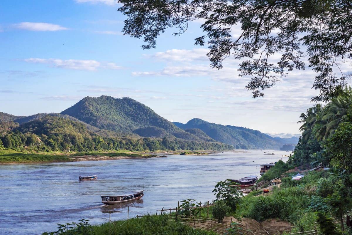 beautiful landscape view of the Mekong river, with small wooden boats on