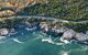 winding road cut into the shoreline cliffs