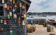 colourful lobster pot markers hanging on a shed