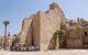 Small group of tourists outside the broken walls