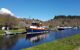 a small cruise boat moored up in the canal