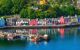 a row of colourful houses on the water's edge