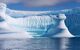 Unusual shaped icebergs floating on blue sea