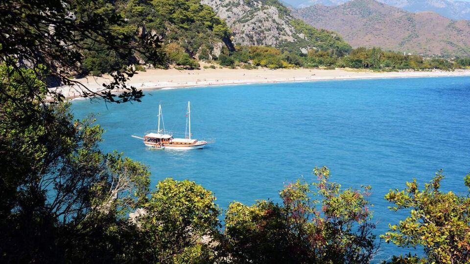 A gulet moored up in a beautiful bay
