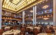 Grand dining room with high ceiling. The Britannia Restaurant on the QM2 is the home of elegant fine dining.